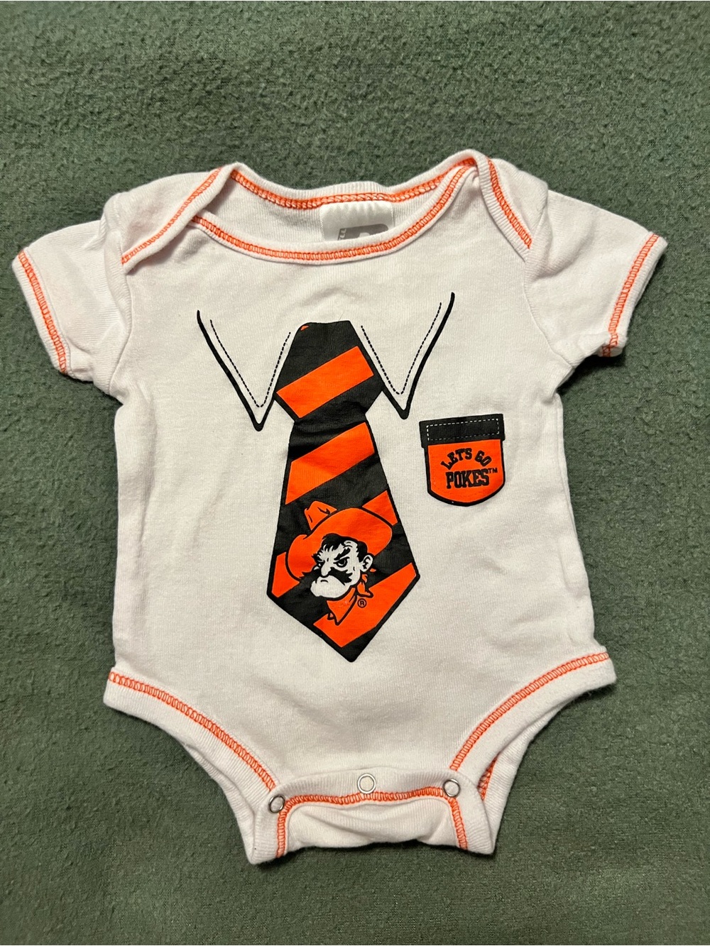 Russell Athletic White Baby One-Piece with Orange & Black Tie Graphic